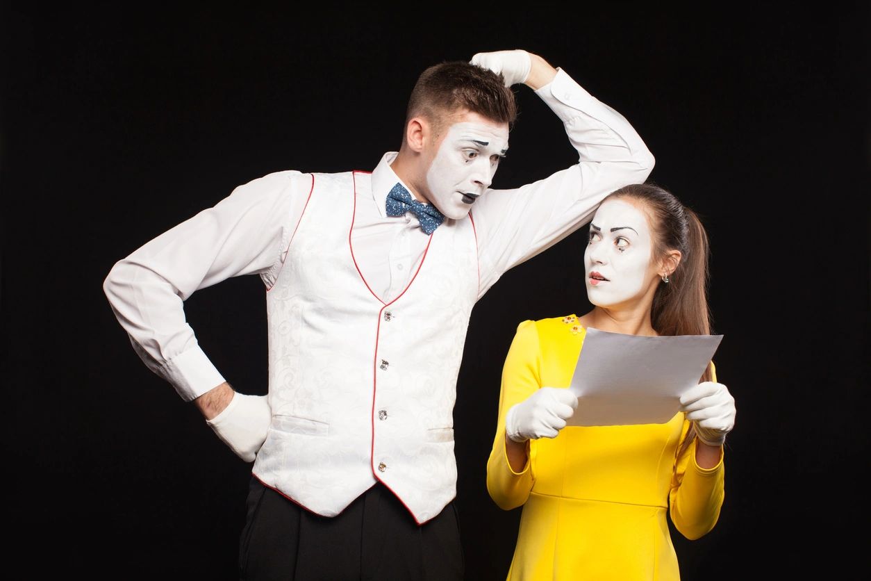A man and woman dressed up as mime.